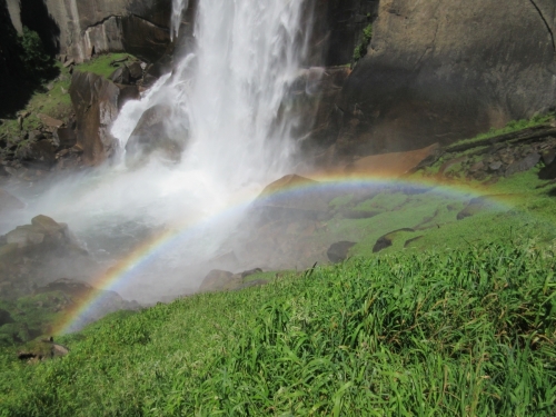 Waterfall rainbow at the foot of Vernal falls Yosemite.